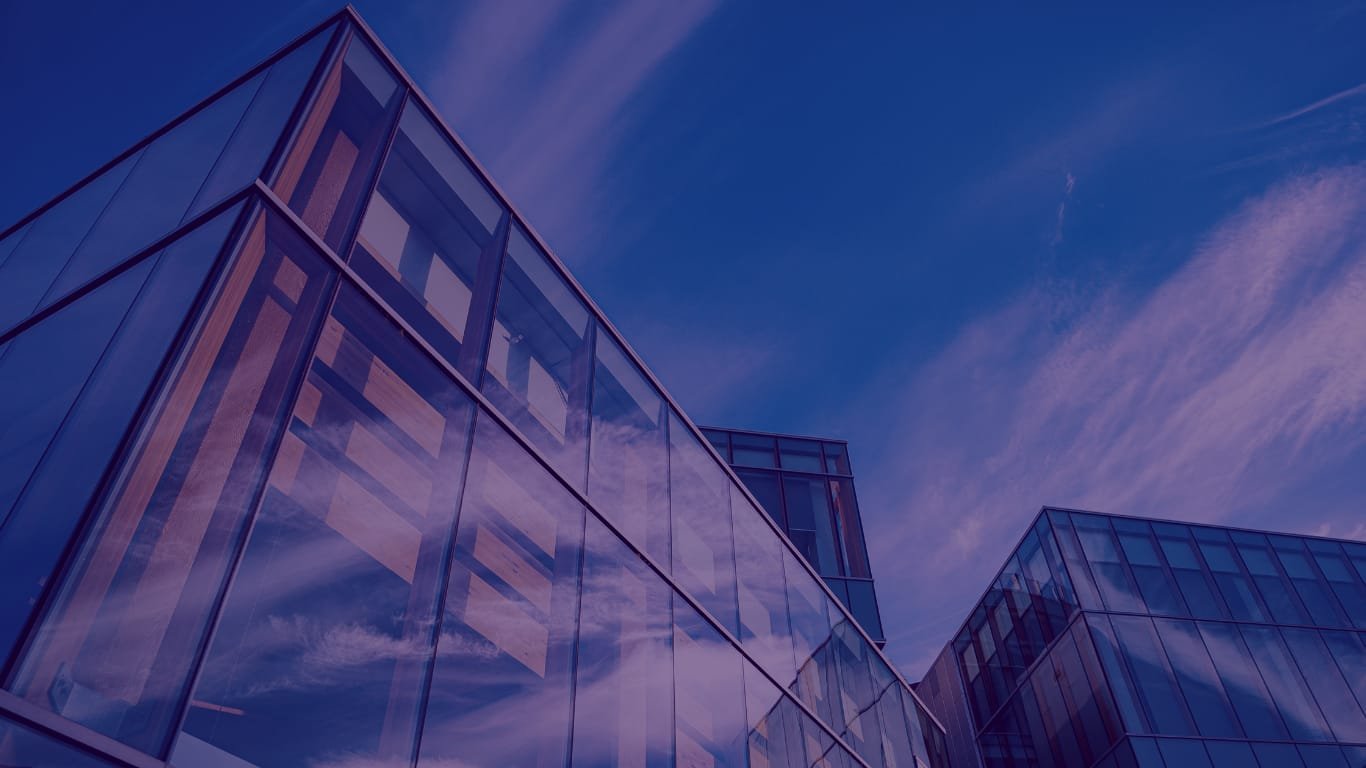 Professional team collaborating in a modern glass office